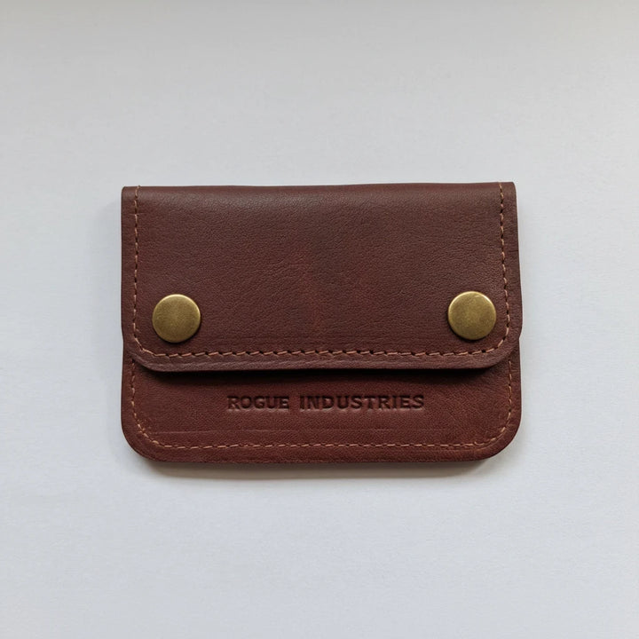Sea Dragon Dreams Rogue full-grain leather belt wallet in brown with brass snap closures and minimalist design.