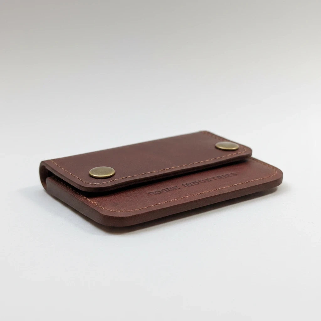 Sea Dragon Dreams Rogue full-grain leather belt wallet in brown with brass snap closures and minimalist design.