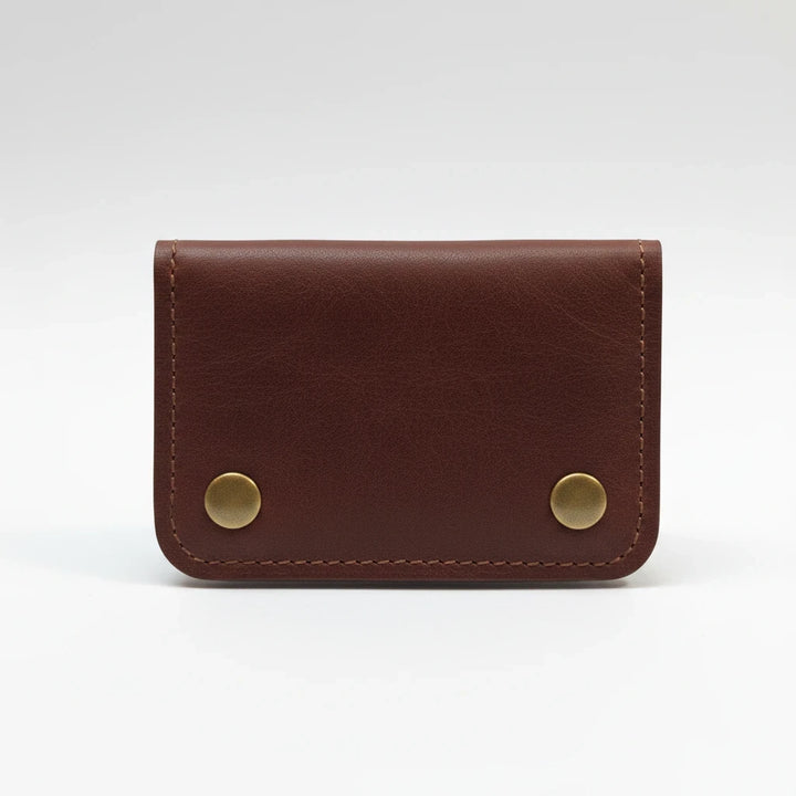 Sea Dragon Dreams Rogue full-grain leather belt wallet in brown with brass snap closures and minimalist design.