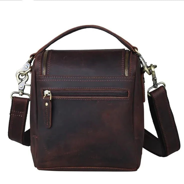 Sea Dragon Dreams The Calista dark brown full-grain leather camera bag with a top handle and adjustable shoulder strap.