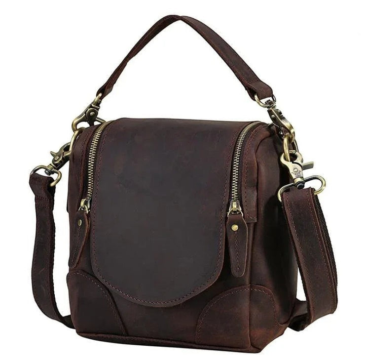 Sea Dragon Dreams Calista handcrafted dark brown full-grain leather camera bag with brass hardware and top handle.