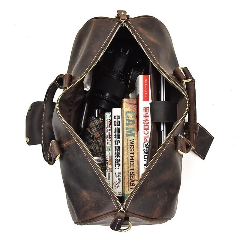 Sea Dragon Dreams Brandt Weekender brown horse leather duffle bag, top view showing spacious interior with items.
