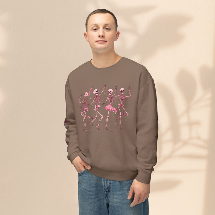 Sea Dragon Dreams brown crewneck sweatshirt featuring a pink dancing skeletons graphic on a male model.