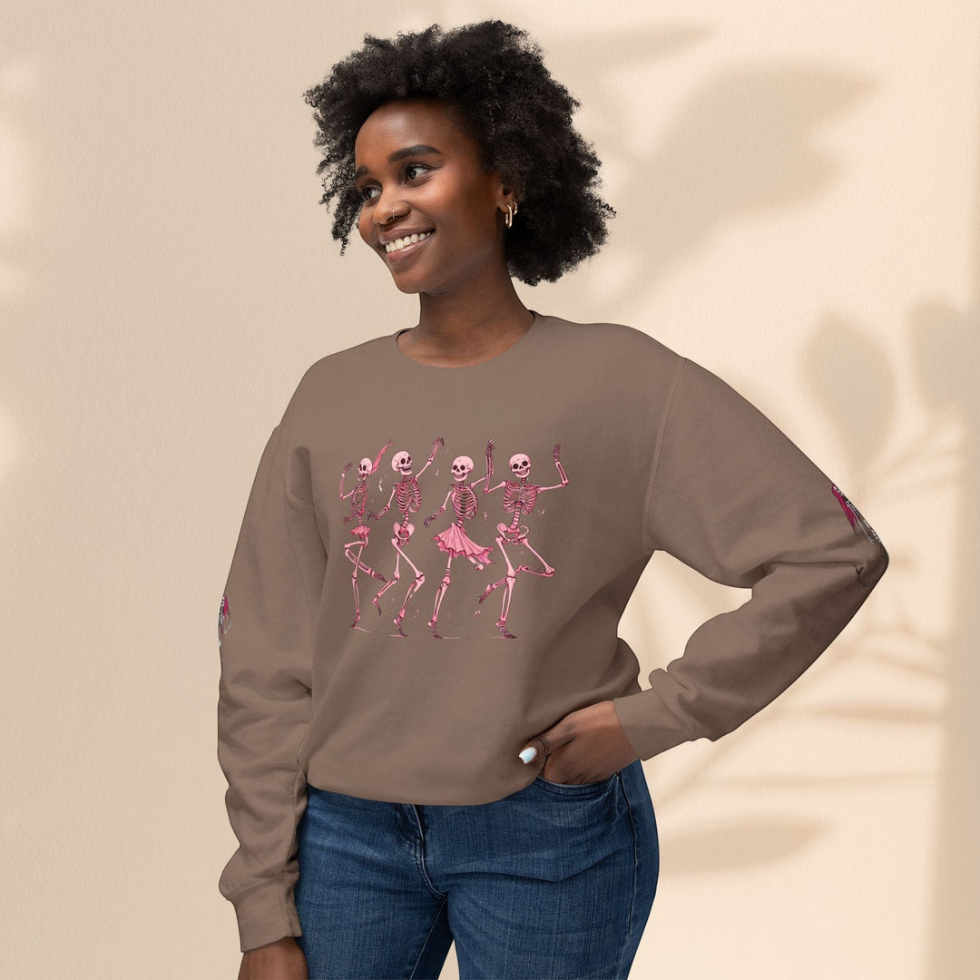 Sea Dragon Dreams brown crewneck sweatshirt featuring a pink dancing skeletons graphic on a smiling woman