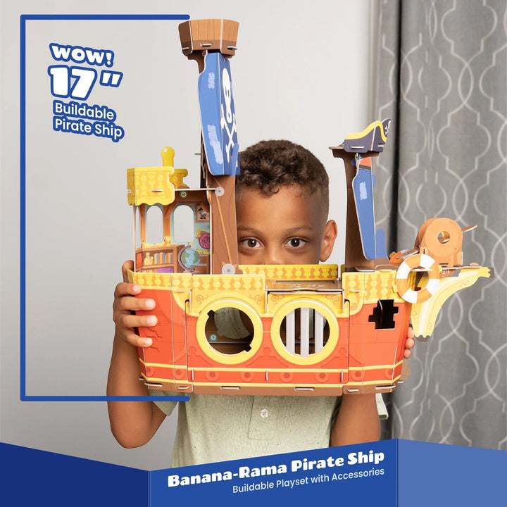 Young boy holding a 17-inch Sea Dragon Dreams Banana-Rama Pirate Ship buildable playset made of recyclable materials.