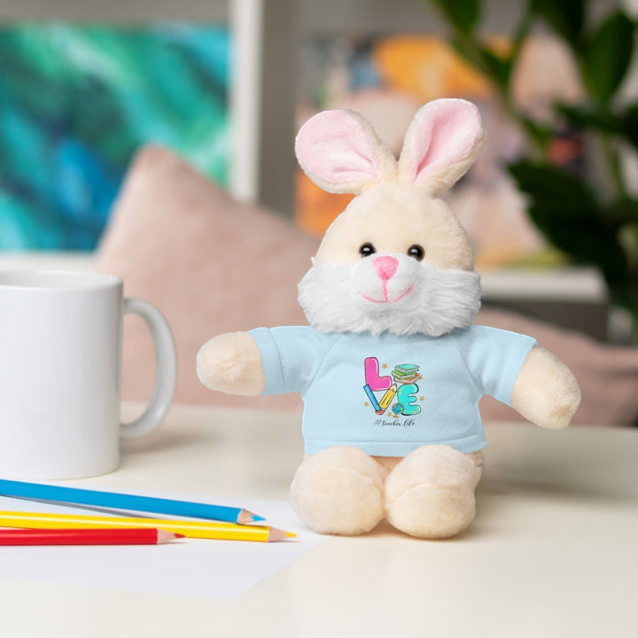 Sea Dragon Dreams plush bunny stuffed animal wearing a light blue t-shirt with Love Teacher Life graphic design