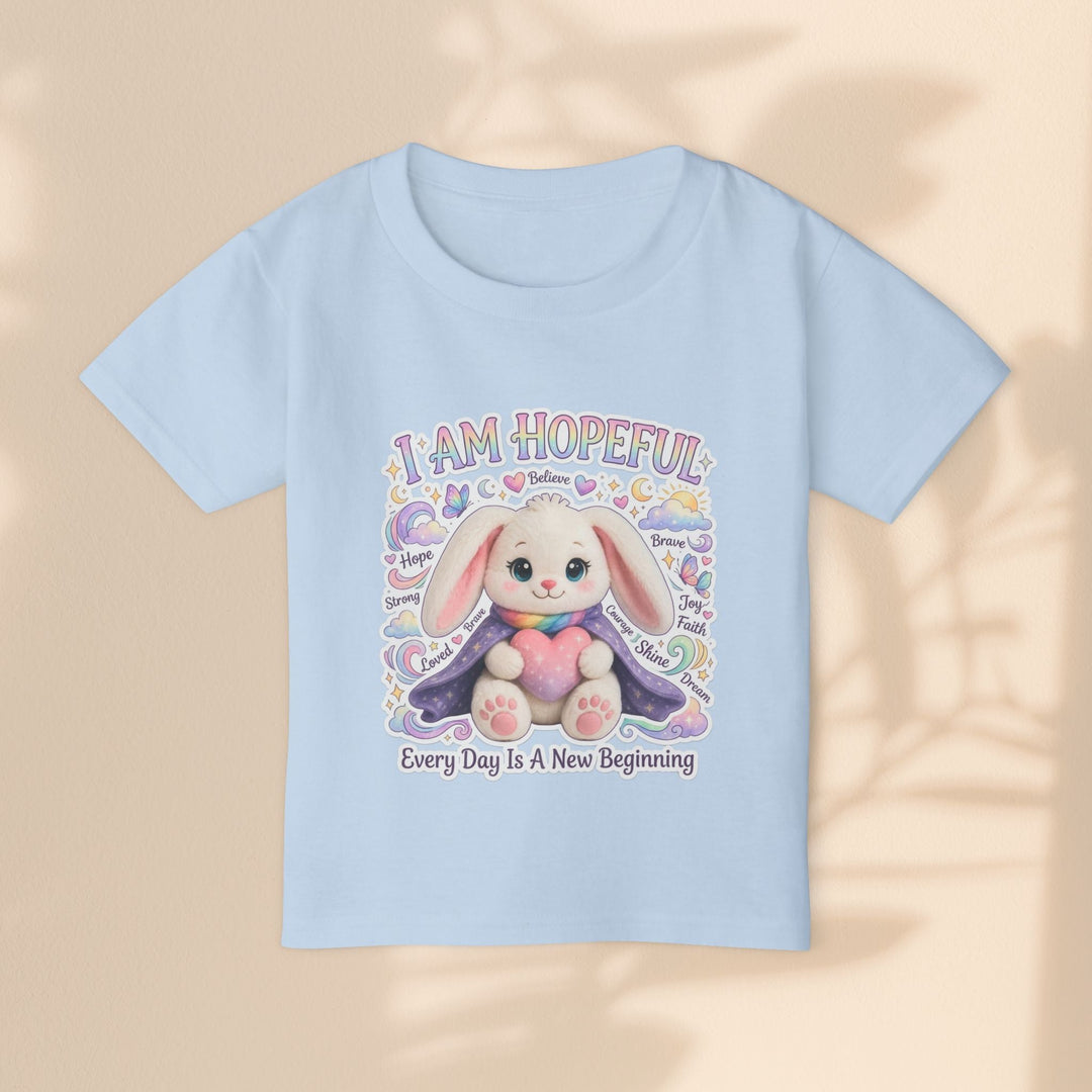 Sea Dragon Dreams light blue cotton toddler t-shirt featuring a cute bunny illustration and hopeful affirmations.