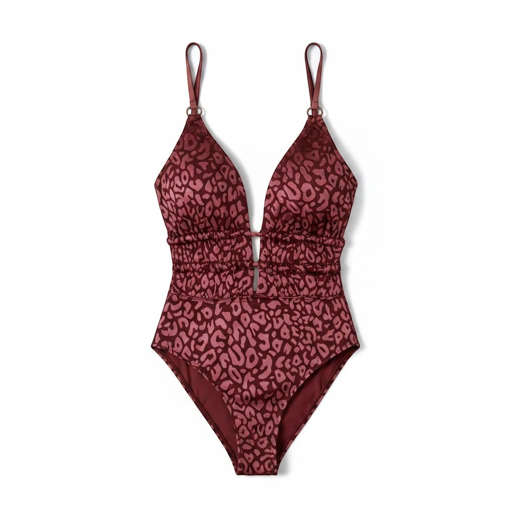 Sea Dragon Dreams burgundy leopard print one-piece swimsuit with a deep V-neck, halter straps, and ruched waist.