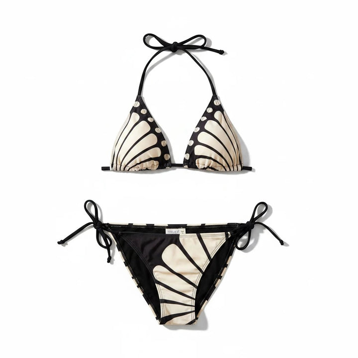Sea Dragon Dreams butterfly print bikini set with braided straps and tie-side bottoms in black and cream.
