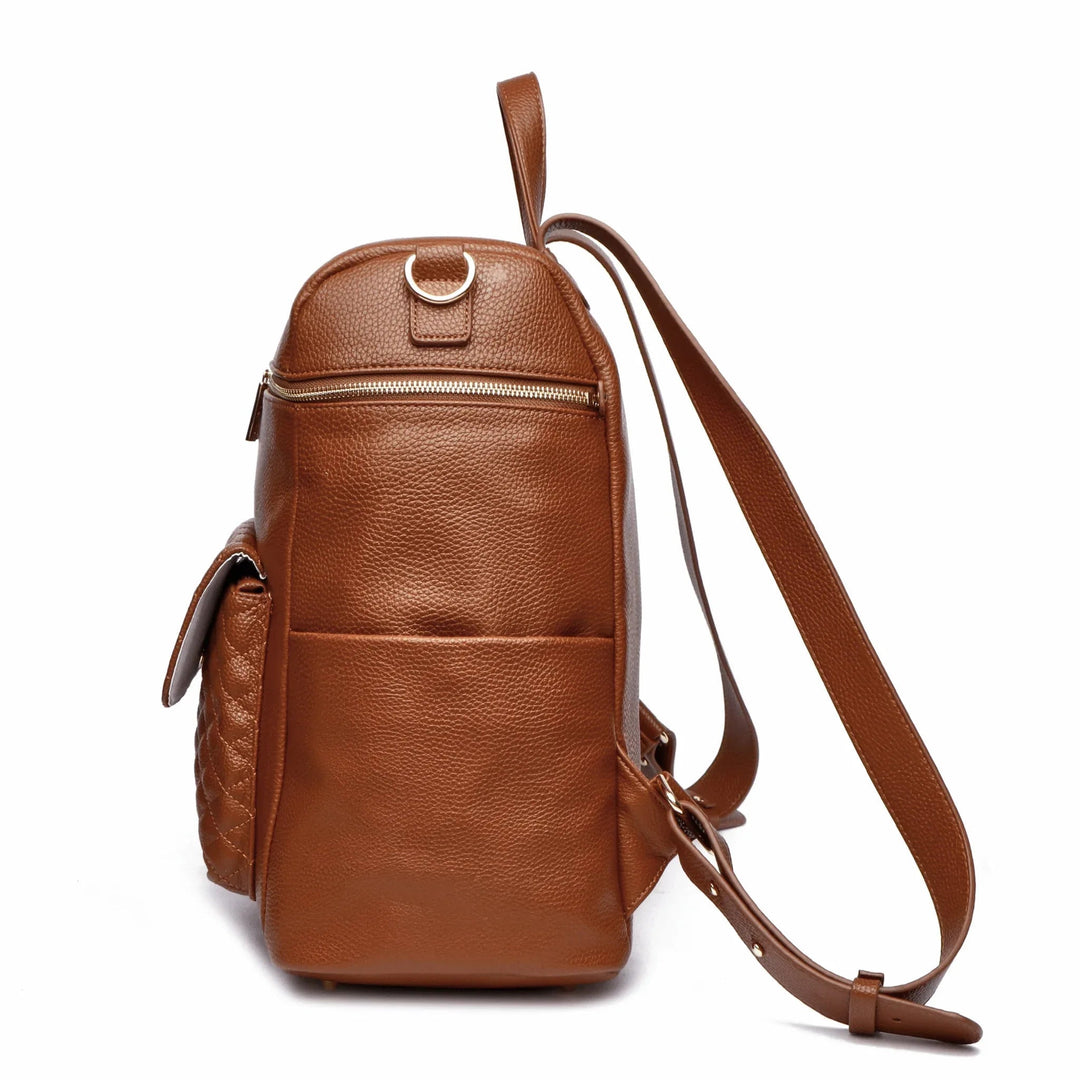 Sea Dragon Dreams Signature diaper bag backpack in caramel brown vegan leather, side view showing straps and pockets
