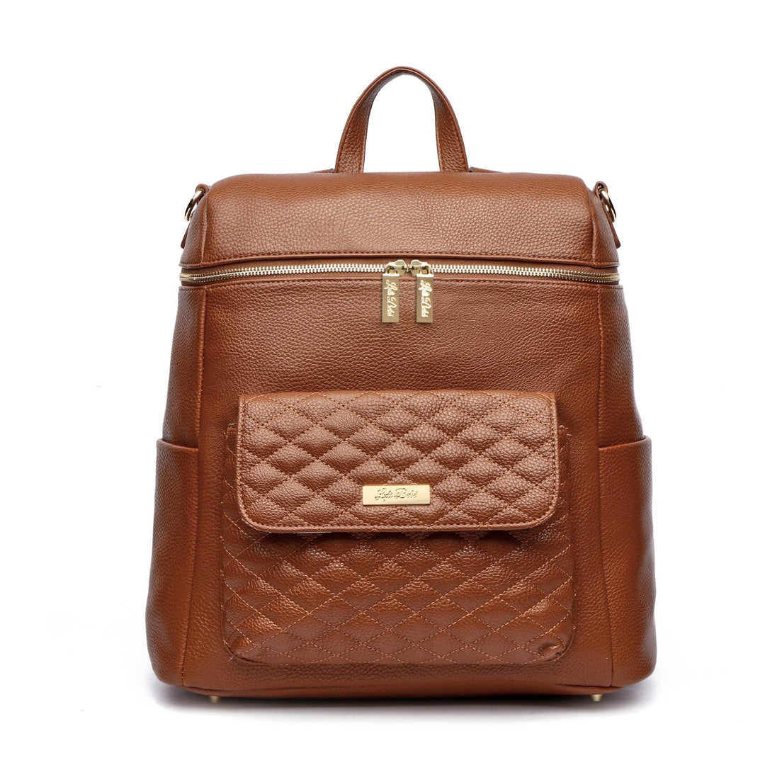 Sea Dragon Dreams Signature diaper bag in caramel brown vegan leather with a quilted front pocket and gold hardware.