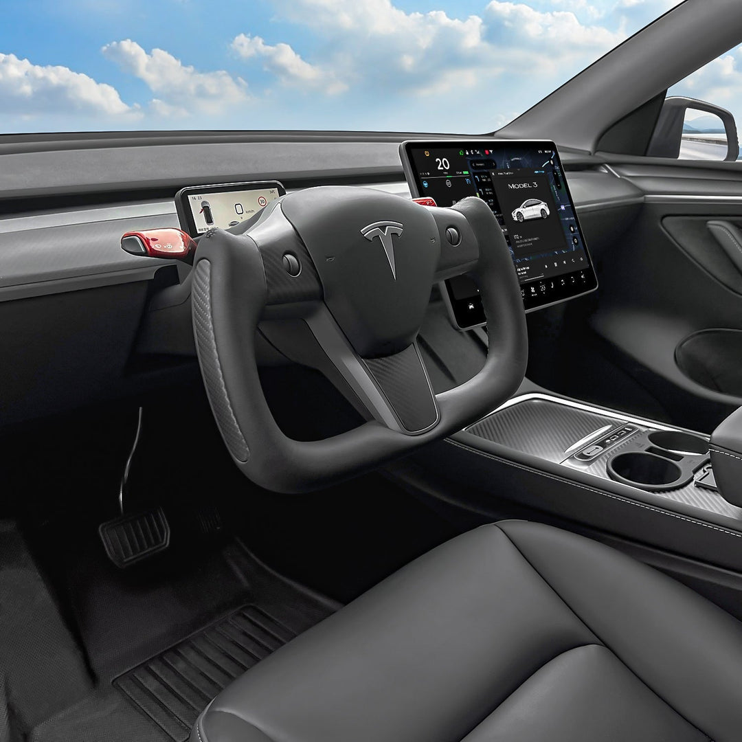 Sea Dragon Dreams carbon fiber yoke steering wheel installed in a Tesla Model 3 interior with a modern cockpit view