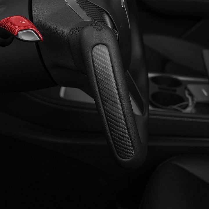 Sea Dragon Dreams carbon fiber yoke steering wheel with red paddle shifter installed in a Tesla Model 3 or Model Y.