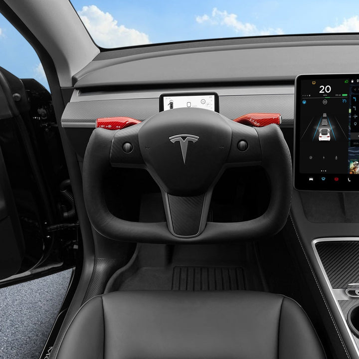 Sea Dragon Dreams carbon fiber yoke steering wheel installed in a Tesla Model 3 or Y with red accents