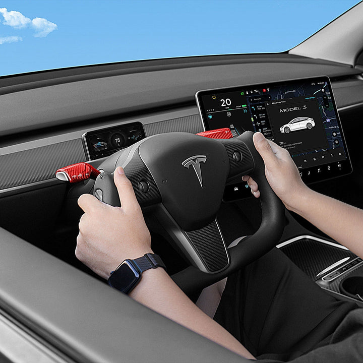 Sea Dragon Dreams carbon fiber yoke steering wheel installed in a Tesla Model 3 with red accent trim