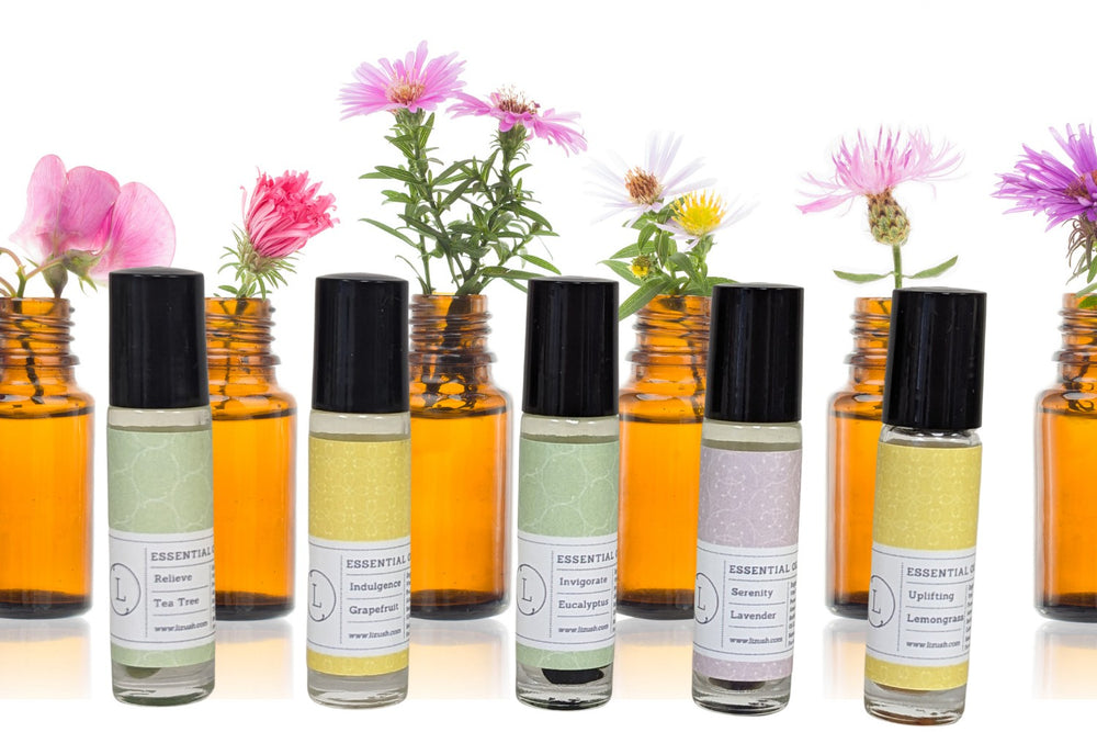 Sea Dragon Dreams CBD essential oil roll-on set featuring five aromatherapy scents with crystals in amber glass bottles
