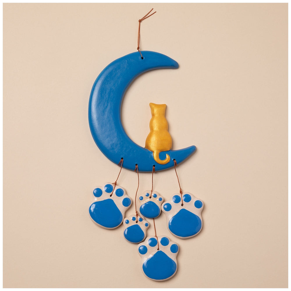 Sea Dragon Dreams handmade ceramic wind chime featuring a blue crescent moon, a gold cat, and blue paw print charms.