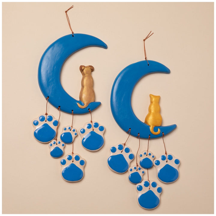 Sea Dragon Dreams handmade ceramic wind chimes featuring blue crescent moons with gold cats and blue paw print charms.