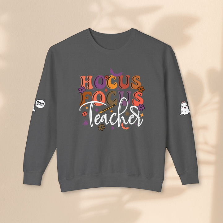 Sea Dragon Dreams charcoal grey crewneck sweatshirt with Hocus Focus Teacher Halloween graphic and sleeve prints.