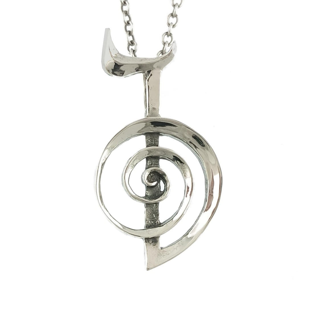 Sea Dragon Dreams handmade sterling silver Cho Ku Rei Reiki pendant with a polished spiral symbol on a silver chain.