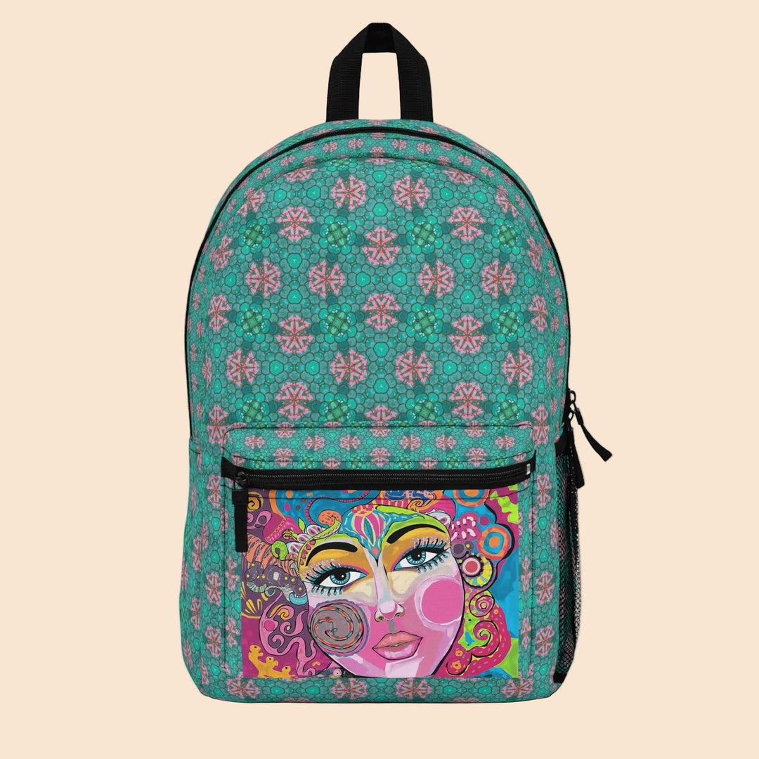 Sea Dragon Dreams backpack featuring a teal geometric pattern and a vibrant abstract art portrait on the front pocket.