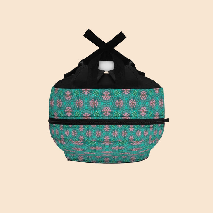 Sea Dragon Dreams Friends Colorful Art Backpack with a vibrant teal and pink abstract pattern and black straps.