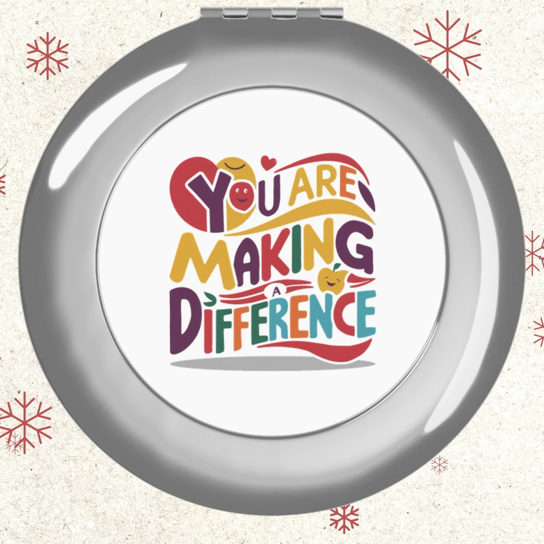 Sea Dragon Dreams round metal compact travel mirror with You Are Making a Difference text design on white insert