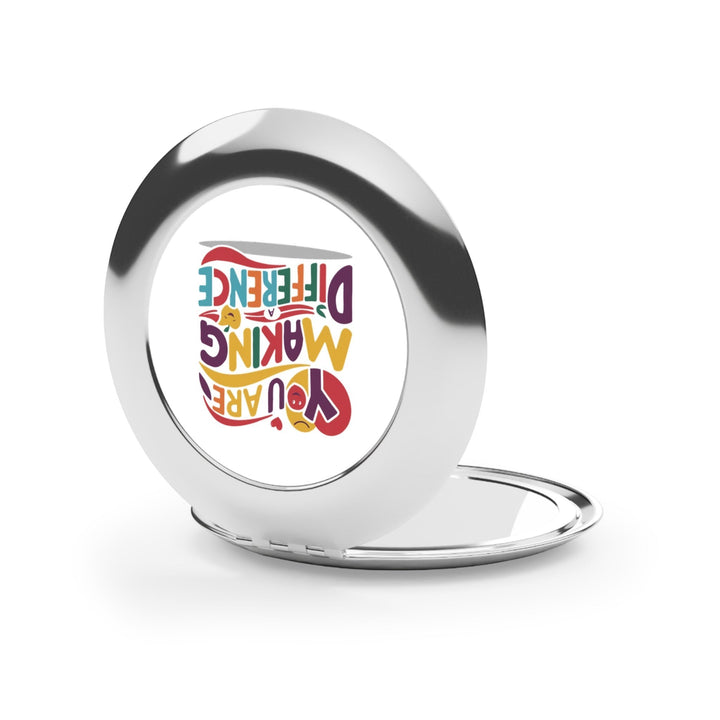 Sea Dragon Dreams compact travel mirror with a polished metal finish and You Are Making a Difference graphic insert.