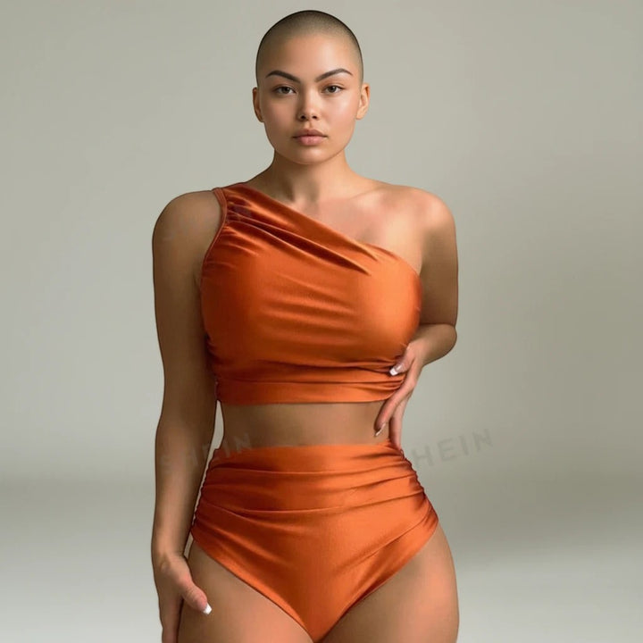 Sea Dragon Dreams high-waist bikini set in metallic copper featuring a one-shoulder top and flattering high-rise bottoms.