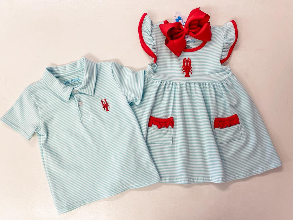 Sea Dragon Dreams baby crawfish outfit set with aqua striped polo shirt and flutter sleeve dress with red trim.