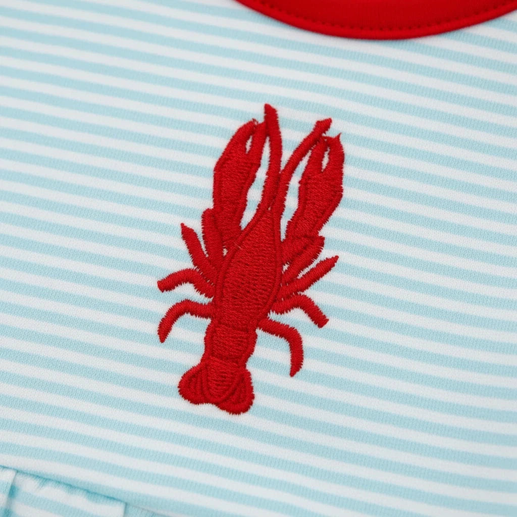 Sea Dragon Dreams baby girl bubble romper featuring a red embroidered crawfish on soft aqua and white striped fabric.