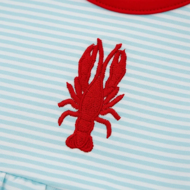 Sea Dragon Dreams baby girl bubble romper featuring a red embroidered crawfish on soft aqua and white striped fabric.