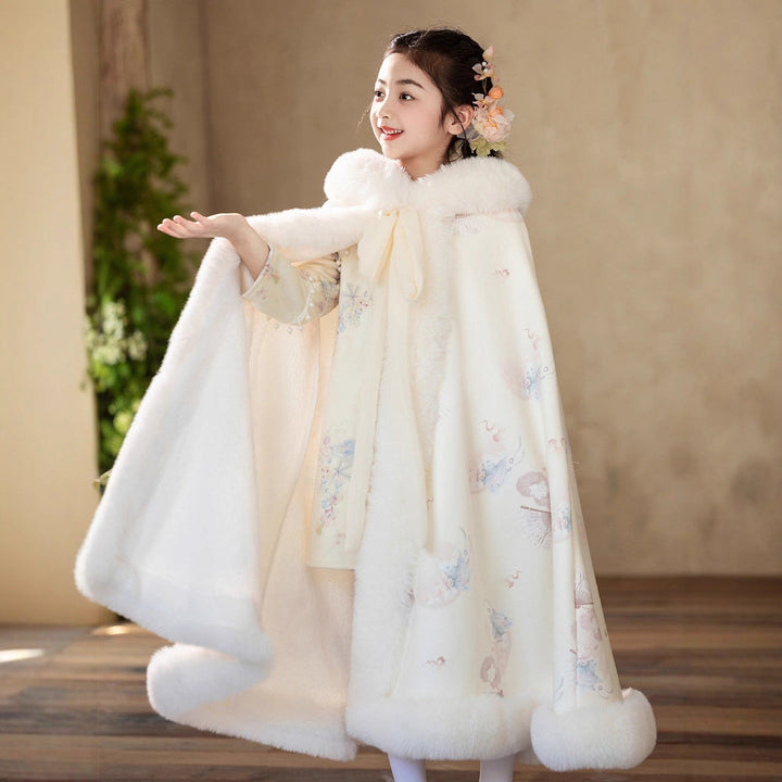 Sea Dragon Dreams girl wearing a cream quilted velvet hooded cloak with faux fur trim for winter special occasions
