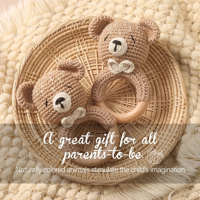 Sea Dragon Dreams crochet bear rattles with wooden rings for sensory play and teething in a woven basket.