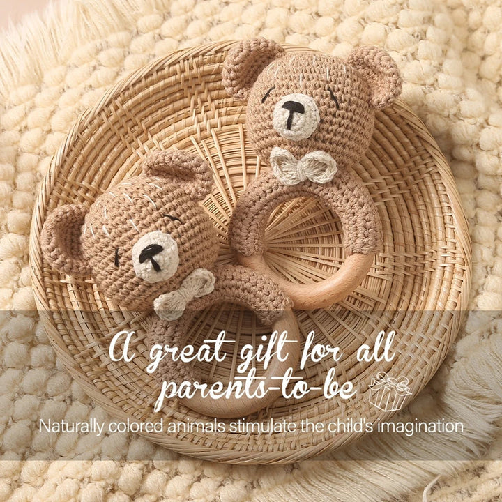 Sea Dragon Dreams crochet bear rattles with wooden rings for sensory play and teething in a woven basket.