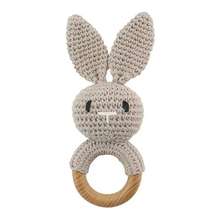 Sea Dragon Dreams beige crochet bunny rattle with a wooden teether ring for sensory play and teething infants