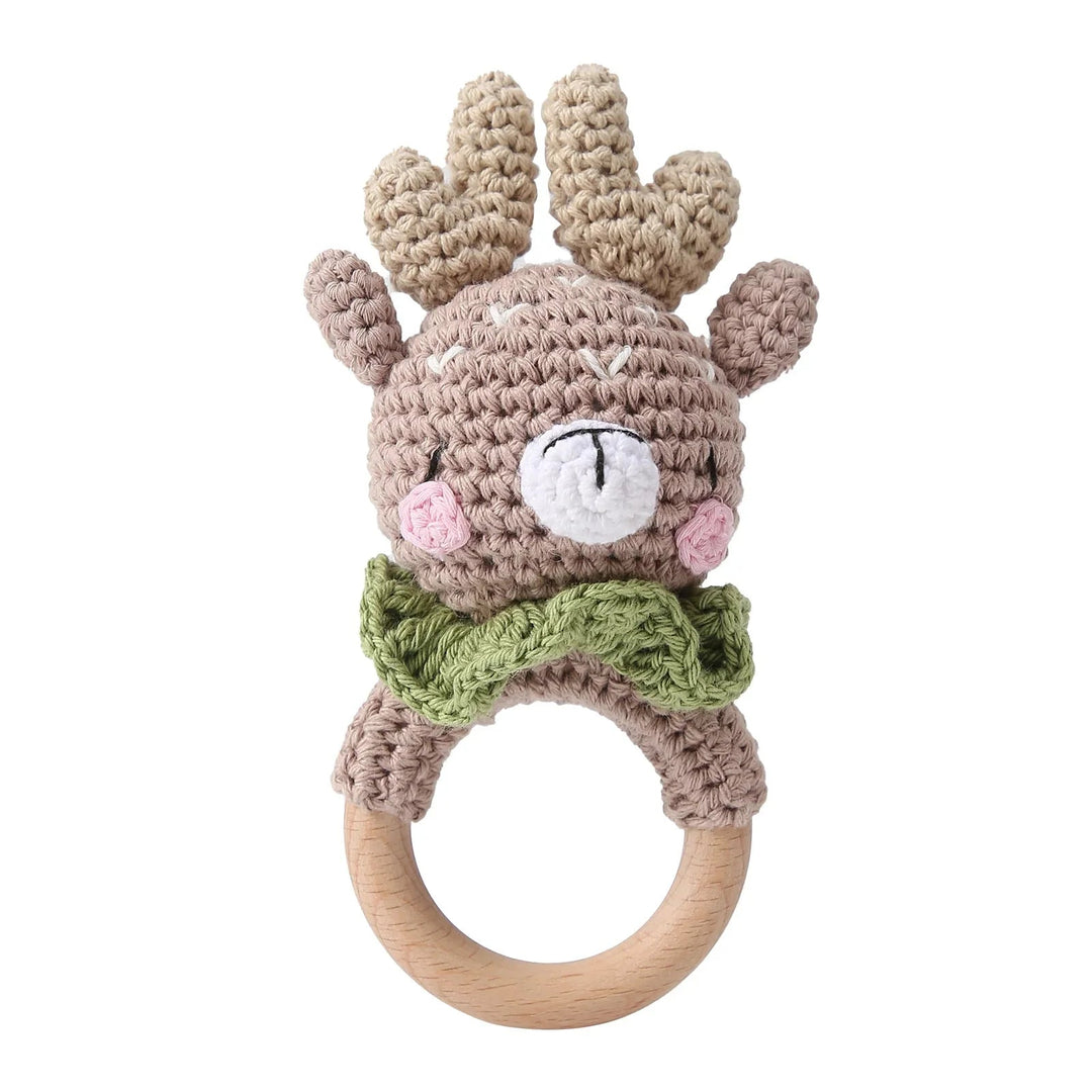 Sea Dragon Dreams crochet deer rattle with a wooden ring teether, featuring soft cotton yarn and a green bow tie.