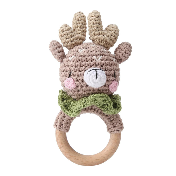 Sea Dragon Dreams crochet deer rattle with a wooden ring teether, featuring soft cotton yarn and a green bow tie.