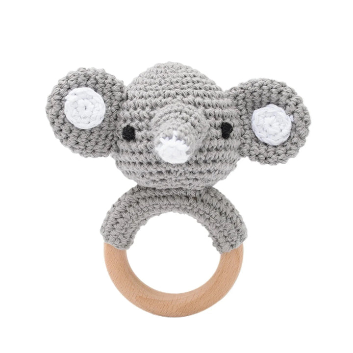Sea Dragon Dreams grey crochet elephant rattle with a natural wooden teether ring for infants.