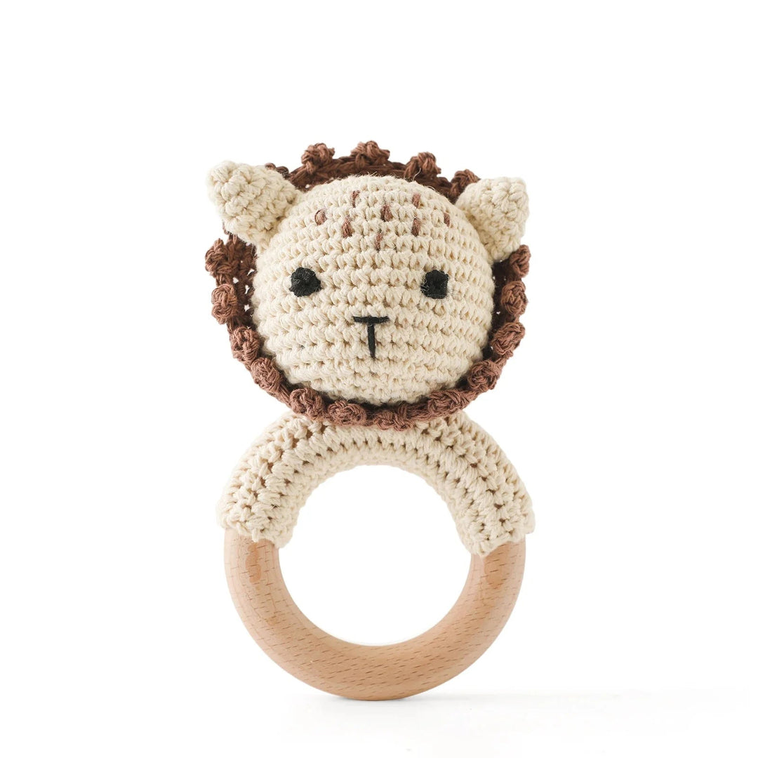 Sea Dragon Dreams crochet lion rattle with a wooden teether ring, perfect for sensory play and soothing baby gums.
