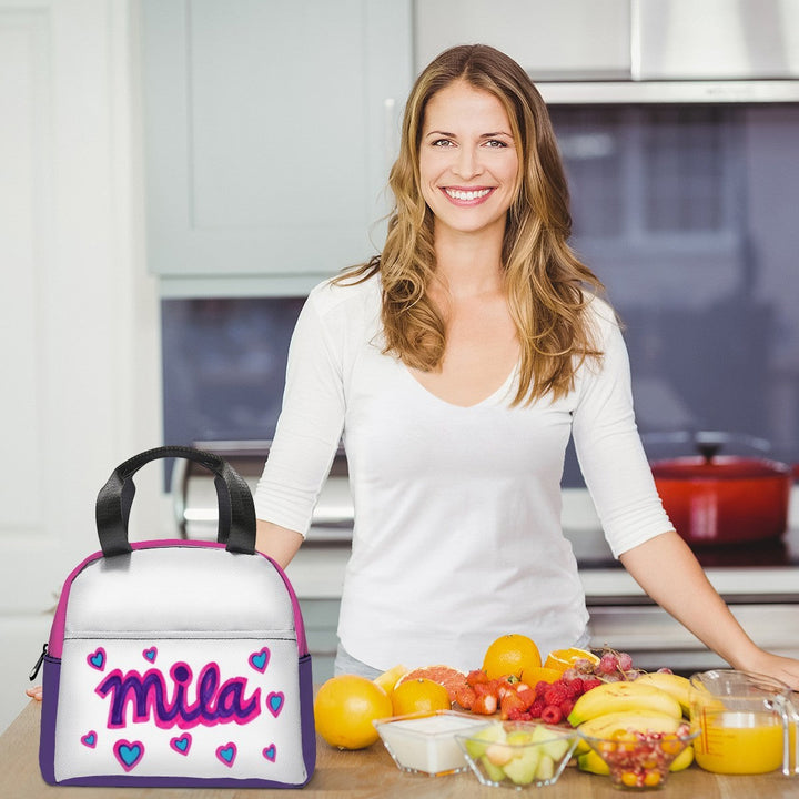 Sea Dragon Dreams custom lunch bag featuring a child's drawing of the name Mila with hearts on a kitchen counter