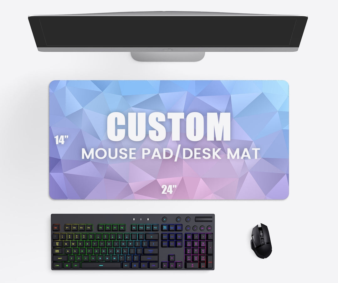 Sea Dragon Dreams custom XL desk mat with geometric blue and purple pattern on a workspace with keyboard and mouse