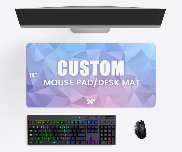 Sea Dragon Dreams custom XL desk mat with geometric blue and purple pattern on a workspace with keyboard and mouse