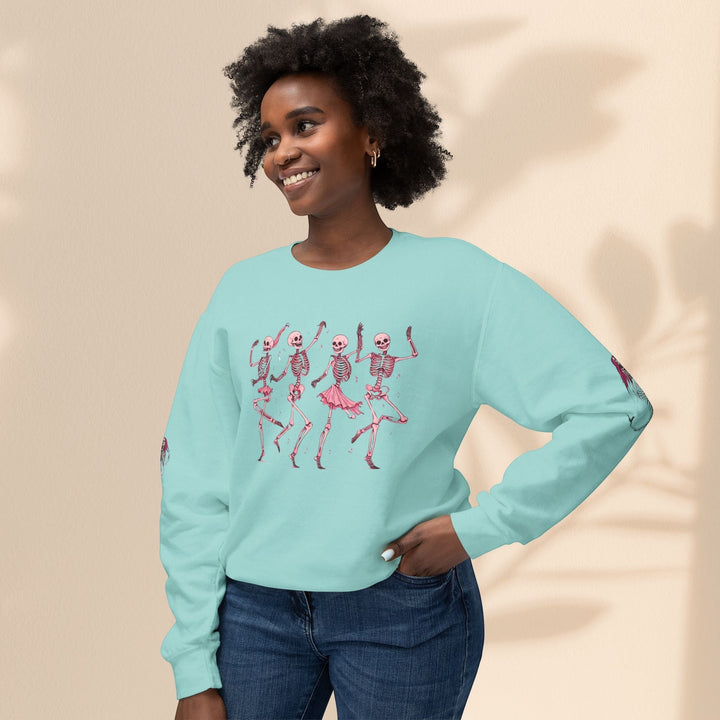 Sea Dragon Dreams unisex light blue crewneck sweatshirt featuring a dancing skeletons graphic on a smiling model.