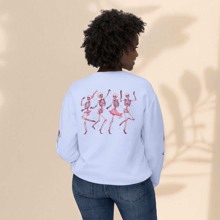 Sea Dragon Dreams light blue crewneck sweatshirt featuring a back print of dancing skeletons in pink ballet outfits.