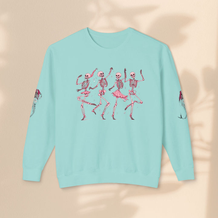 Sea Dragon Dreams light blue crewneck sweatshirt featuring a graphic of four dancing skeletons in pink tutus.