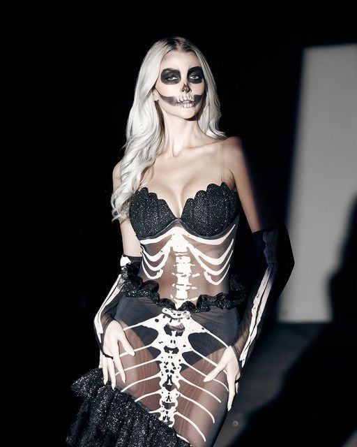 Sea Dragon Dreams dark mermaid costume featuring a shell-cup bodice and skeleton-print fishtail skirt with matching gloves