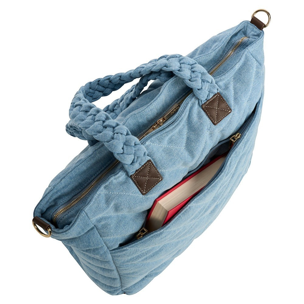 Sea Dragon Dreams denim quilted HydroTote bag with braided handles and exterior pocket holding a book