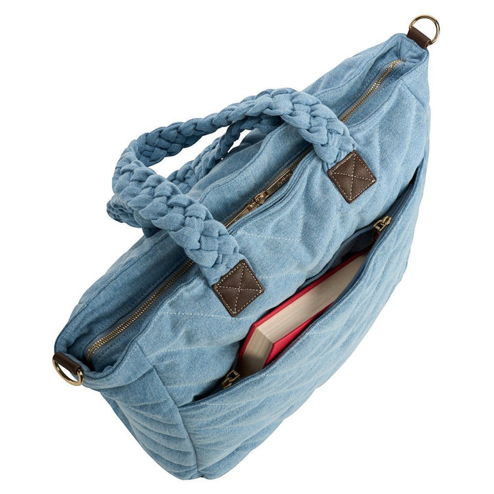 Sea Dragon Dreams denim quilted HydroTote bag with braided handles and exterior pocket holding a book