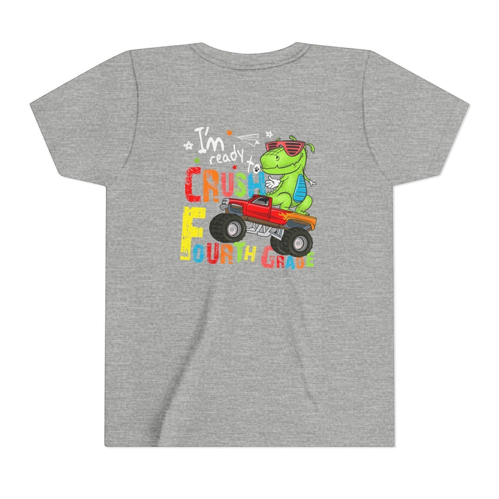 Sea Dragon Dreams grey youth t-shirt featuring a green dinosaur driving a red monster truck for fourth grade.